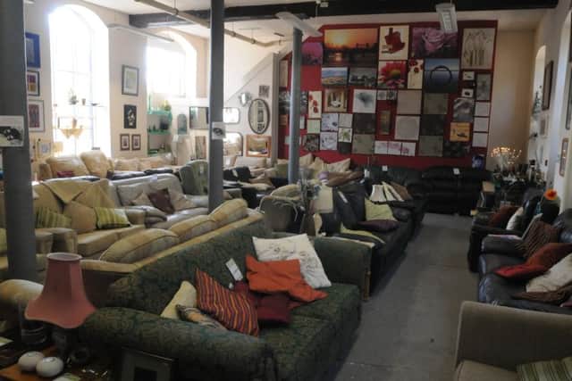 Homeless charity Emmaus Sheffield. Sofas on sale in the shop.