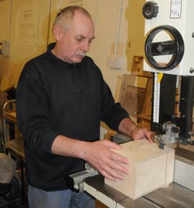 St Wilfrid's Centre for the homeless, vulnerable and socially-excluded. Keith Dewsnap, who came to the centre for help and now works there having turned his life around, in the workshop.