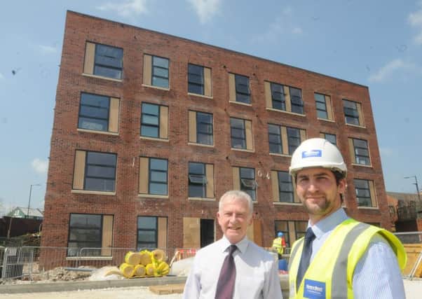 St Wilfrid's Centre for the homeless, vulnerable and socially-excluded. Charity director Kevin Bradley with site manager Laurence Ross, from Henry Boot, outside the new residential block.