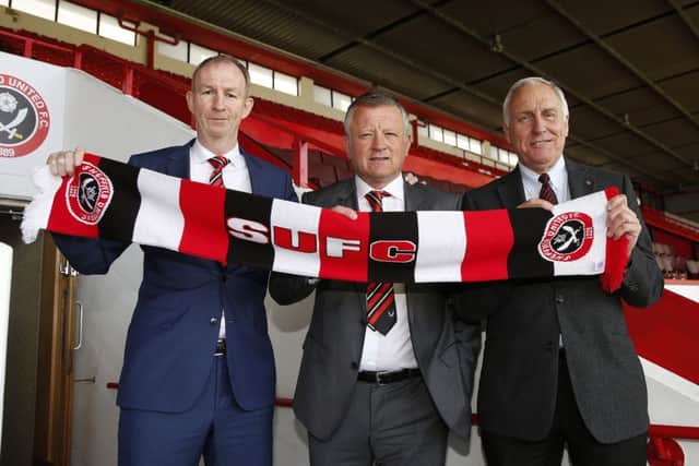Chris Wilder is flanked by his assistant Alan Knill and co-owner Kevin McCabe
©2016 Sport Image all rights reserved
