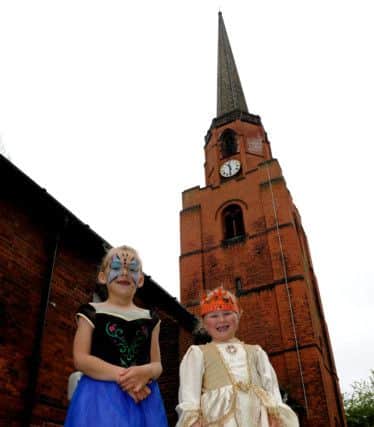 Kacie-Marie Wright (l), eight, and Grace Goodall, seven have dressed up in medieval outfits for the Woodlands May Festival at All Saints Church. Picture: Andrew Roe