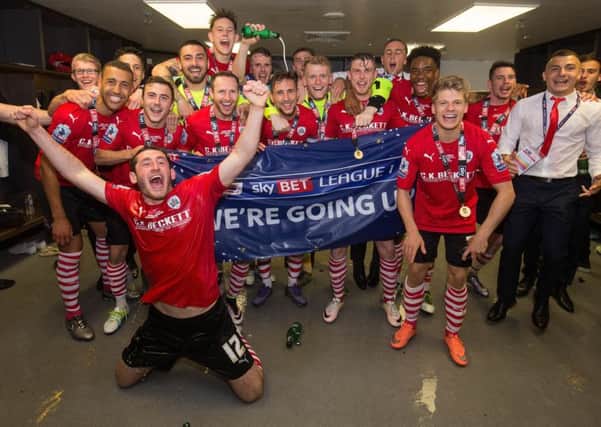 Barnsley players inside the dressing room after winning the Sky Bet League One Play-Off Final against Millwall at Wembley Stadium, London. PRESS ASSOCIATION Photo.