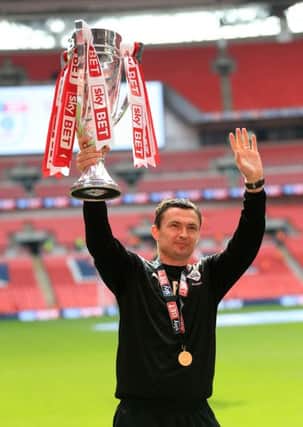 Barnsley caretaker manager Paul Heckingbottom celebrates with the trophy after winning the Sky Bet League One Play-Off Final at Wembley Stadium, London. PRESS ASSOCIATION Photo