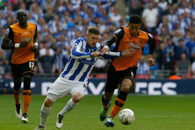 Gary Hooper battles with Curtis Davies for possession