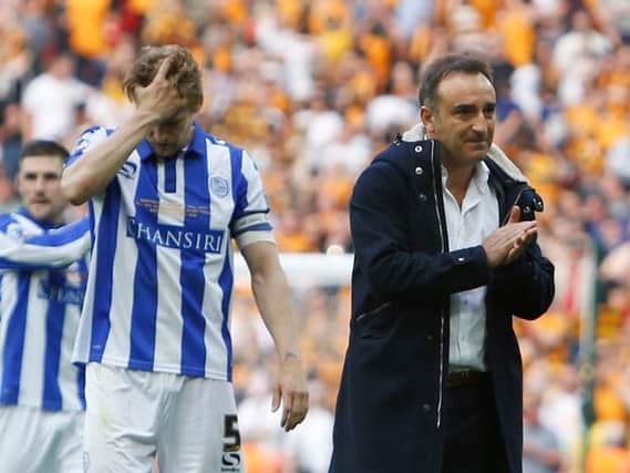 Skipper Glenn Loovens and head coach Carlos Carvalhal after the final whistle at Wembley following defeat to Hull City