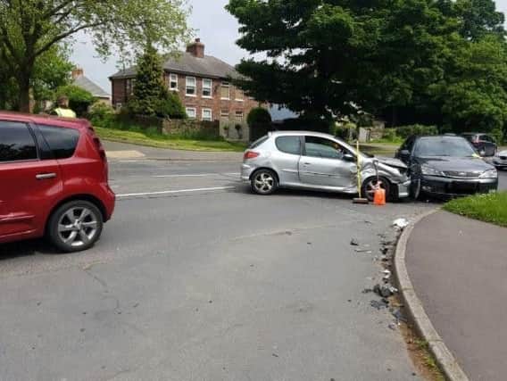 A Sheffield road is currently closed, after a car that was being pursued by police ploughed into two vehicles on a residential street.