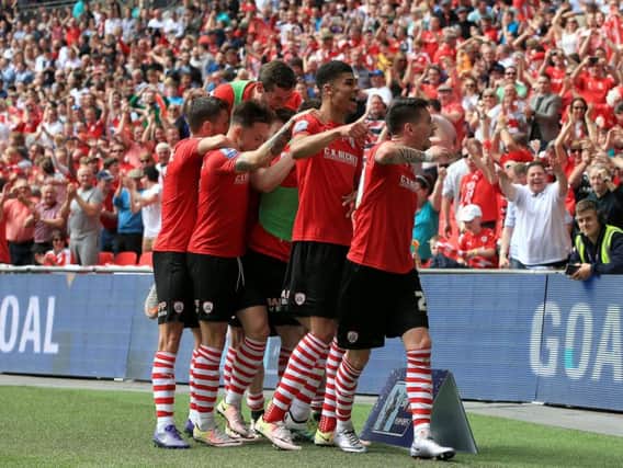 Barnsley's Adam Hammill (right) celebrates with team-mates after scoring his teams second goal scoring his side's second goal