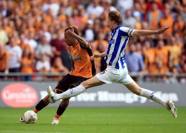 Wednesday's Glenn Loovens (right) challenges Hull City's Abel Hernandez during the Championship Play-Off final at Wembley