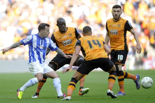 Owls Ross Wallace threads a pass through a mass of City players...Pic Steve Ellis