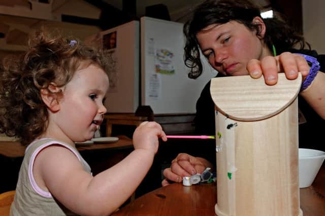 Imogen Farah paints a birdhouse with Victoria Middleton, of Ferndale Garden Centre as part of National Children's Gardening Week, at Ferndale Garden Centre. Picture: Andrew Roe