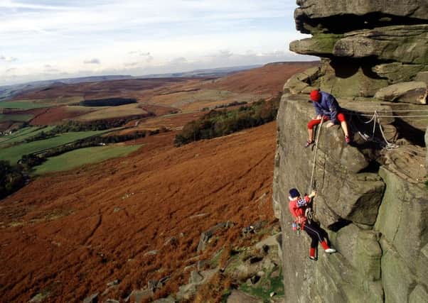 Rock climbing at Stanage Edge, Derbyshire. At four miles long, it has some of the best climbing in the Peak District and is only 15 minutes from Sheffield.