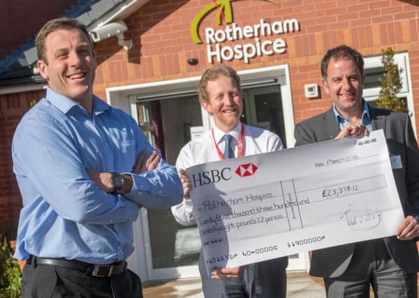 Alex Fletcher, commercial director of Horbury Group, Christopher Duff chief executive of Rotherham Hospice and Trevor Wragg, managing director of the Horbury Group with a cheque for over Â£23,000 donated to the hospice after workers at The Horbury Group gave a day's pay to the charity.