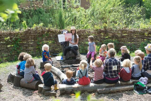 The Sheffield Woodland Kindergarten at Lynwood Gardens where children are taught in the open air
Helen Mark reads the children a story in their woodland setting
Picture Dean Atkins