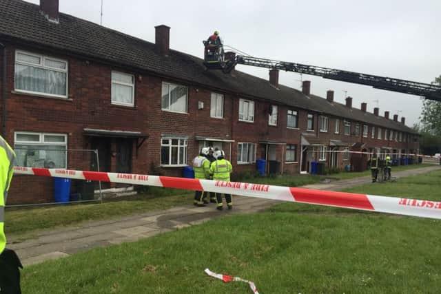 Fire fighters on Leighton Road, Gleadless Valley as they deal with a house fire