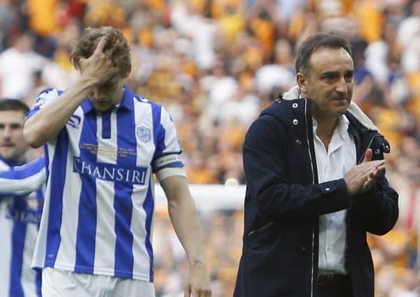 Glenn Loovens and Carlos Carvalhal show their disappointment at the final whistle