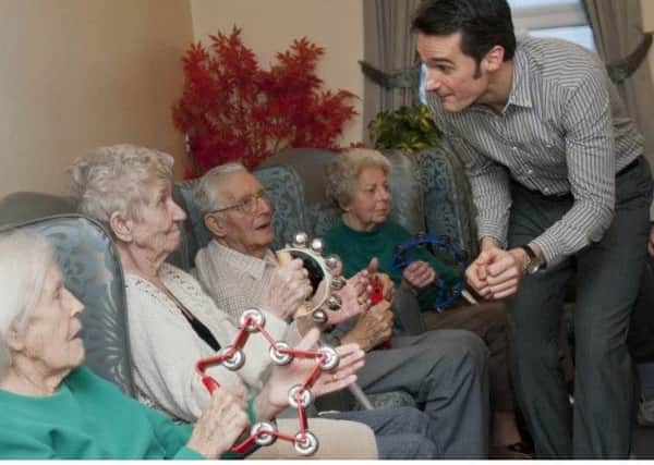 A Lost Chord musician performs for residents of Waterside Grange Care Home in Dinnington.