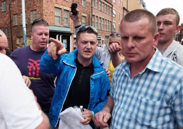Tommy Robinson (centre), at an EDL rally in Sheffield in 2013. He is now leader of the Pegida group who are marching through Rotherham on Saturday.