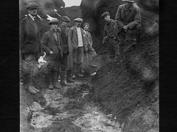 Ramblers in the moss-hags and peat groughs at Kinder Scout in January 1924. Bert Ward is in the white jumper