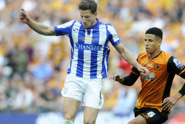Sam Hutchinson races away from Hull's Curtis Davies in the play-off final