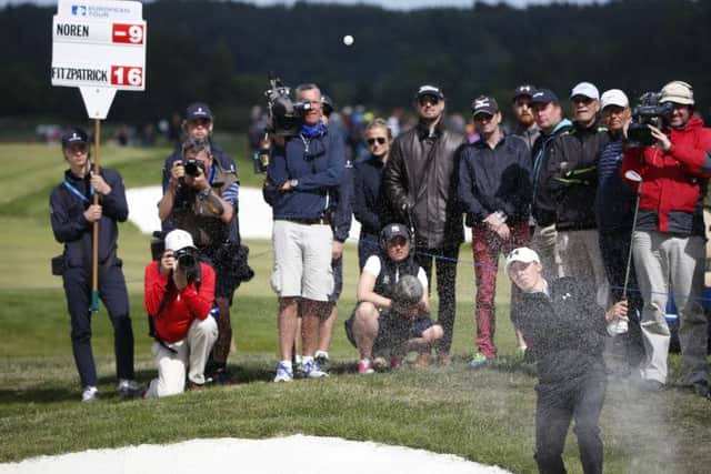 Matthew Fitzpatrick watches his shot from a bunker on the ninth hole during the last round of the Nordea Masters golf tournament at the Bro Hof golf club, Stockholm