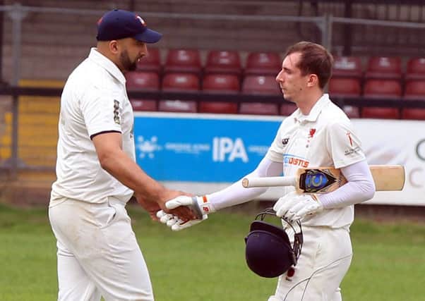 Barnsley batsman Stevie Walters is congratulated on his 58 in the victory over Rotherham Town.