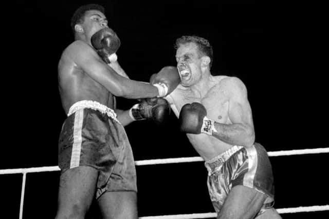 Ali and Henry Cooper during their fight at Wembley