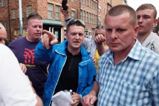 Tommy Robinson (centre), at an EDL rally in Sheffield in 2013. He is now leader of the Pegida group who are marching through Rotherham  today