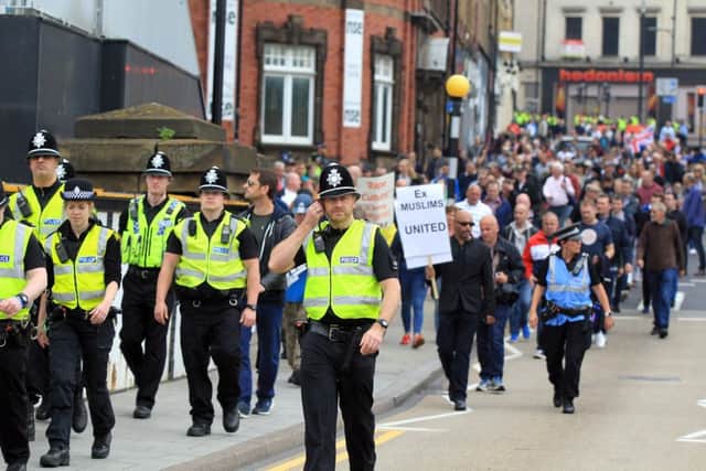 Members of the Pegida group staged a silent protest march through the streets of Rotherham over the town's abuse scandal.