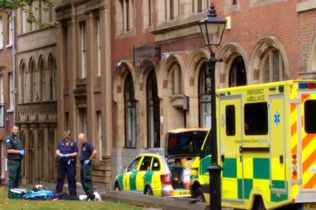 Paramedics attend to a street drinker  in the city centre. Residents claim people getting drunk and high on drugs are ruining the area as plans for a third off-licence goes to Sheffield Council planning committee - Photo: Sheffield City Centre Residents' Action Group
