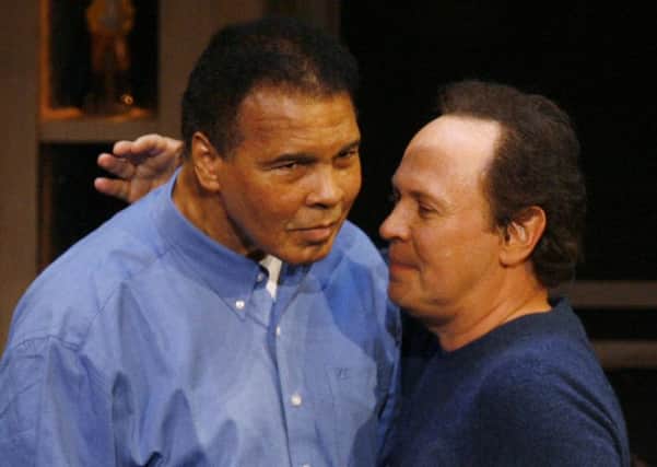 Billy Crystal, right, hugs boxing legend Muhammad Ali on his 65th birthday on the campus of Arizona State University in 2007. Crystal is expected to speak at Ali's funeral in Louisville, on Friday