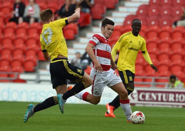 Harry Middleton runs at the Boro defence during last year's friendly.