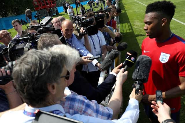 England's Daniel Sturridge speaks with the media during a training session at Stade de Bourgognes, Chantilly. PRESS ASSOCIATION Photo.