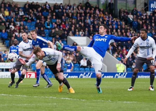 Chesterfield vs Bury - Lee Novak stretches for the ball - Pic By James Williamson