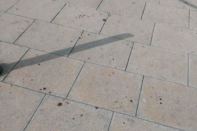 Blood spattered pavement near to Wicker Arches, where a suspected stabbing has taken place.