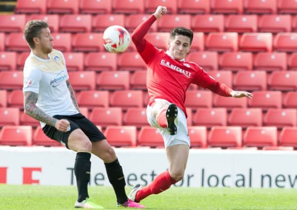 Barnsley's Josh Brownhill battles with George Moncur
 Picture Dean Atkins