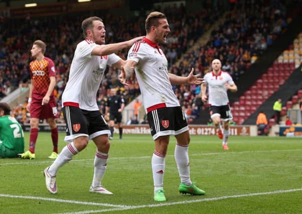 New captain Billy Sharp (right) celebrates with Marc McNulty after scoring for Sheffield United last season