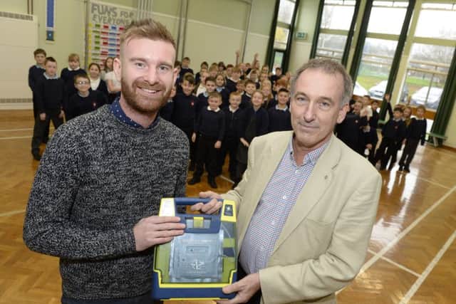 Ken Waight (right) has raised tens of thousands of pounds for SADS UK since 2011