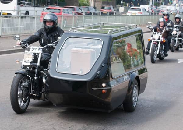 Bikers follow the hearse at the funeral of Brian Senior along Penistone Road in Hillsborough