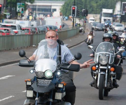 Bikers follow the hearse at the funeral of Brian Senior along Penistone Road in Hillsborough
