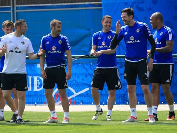 Kyle Lafferty jokes with Northern Ireland team mates on his return to training