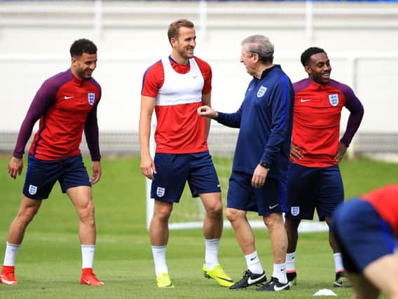 Harry Kane talks with England coach Roy Hodgson