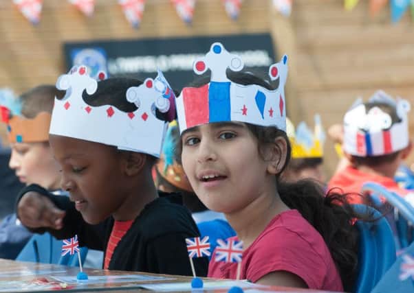 Pupils at Lowfield Primary School have a street party to celebrate the Quenns 90th birthday