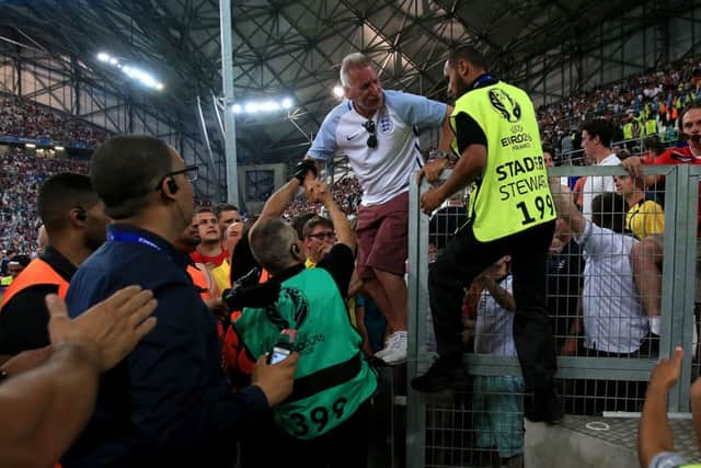 England fans try to get out of the stands after tempers flare during the UEFA Euro 2016, Group B match at the Stade Velodrome, Marseille. Photo: Nick Potts/PA Wire.
