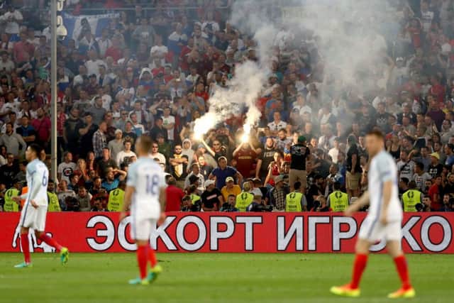 Tempers flare between rival fans in the stands during the UEFA Euro 2016, Group B match at the Stade Velodrome, Marseille. Photo: Owen Humphreys/PA Wire.