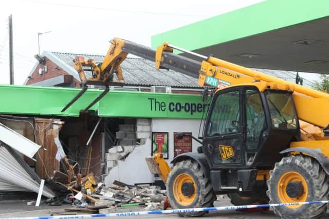 This was the aftermath of the burglary on July 17, 2015 when thieves used a JCB Telehandler to rip an ATM from the petrol station wall.