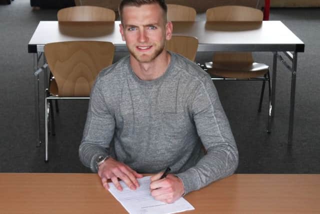 George Long signs his new deal