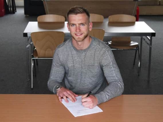 George Long signs his new Blades deal