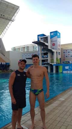 Freddie Woodward  with his coach Tom Owens at the Rio pool