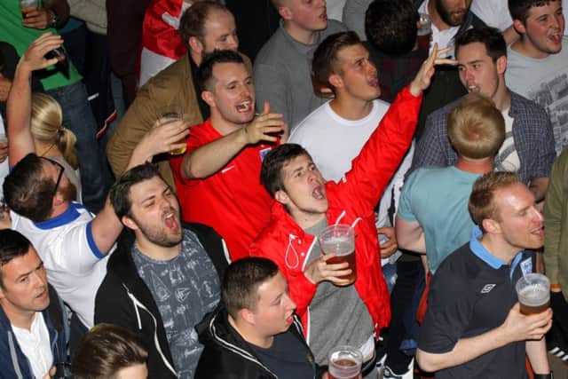 Fans watching England v Wales in Euro2016 at the Walkabout pub in Sheffield. Photo: Chris Etchells