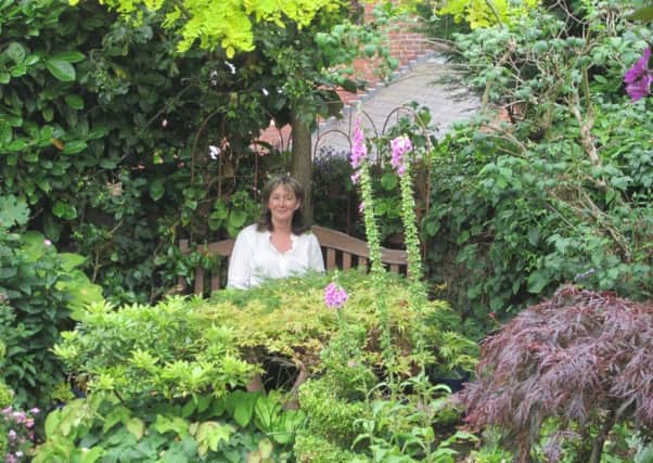 Sheffield gardener Marian Simpson prepares to open her garden for charity